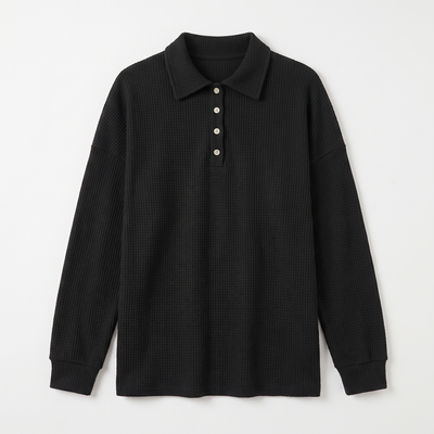 Black waffle-knit sweater flat lay