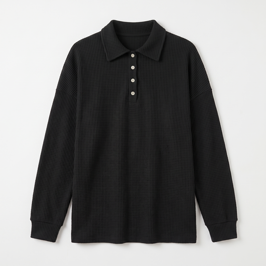 Black waffle-knit sweater flat lay